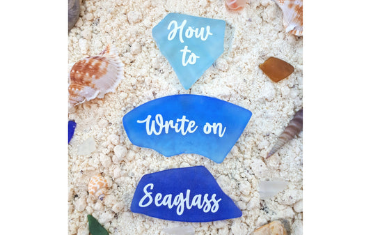 3 pieces of blue seaglass with the words "How to write on seaglass" on them in white lettering