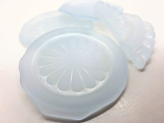 Light blue seaglass pieces with flower pattern